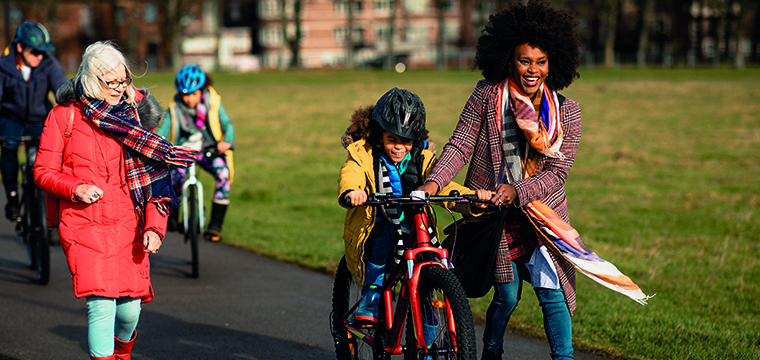 Brand photography for Bowel Research UK featuring families having fun at the park