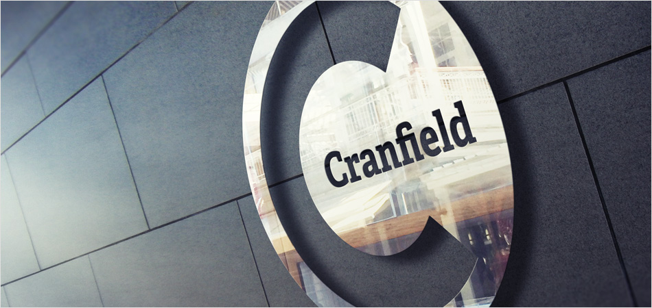 Cranfield University logo shown on chrome building signage