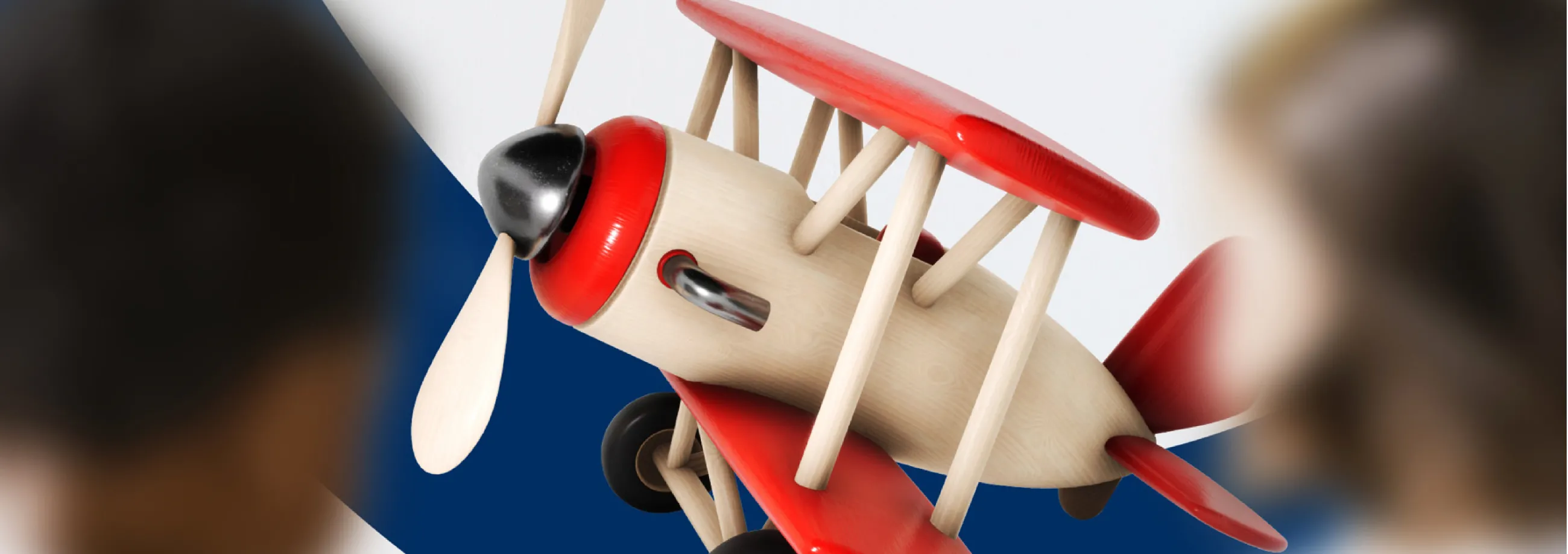 RAFA Kidz brand image showing small wooden propeller plane and two kids along with bright graphics in red and navy blue